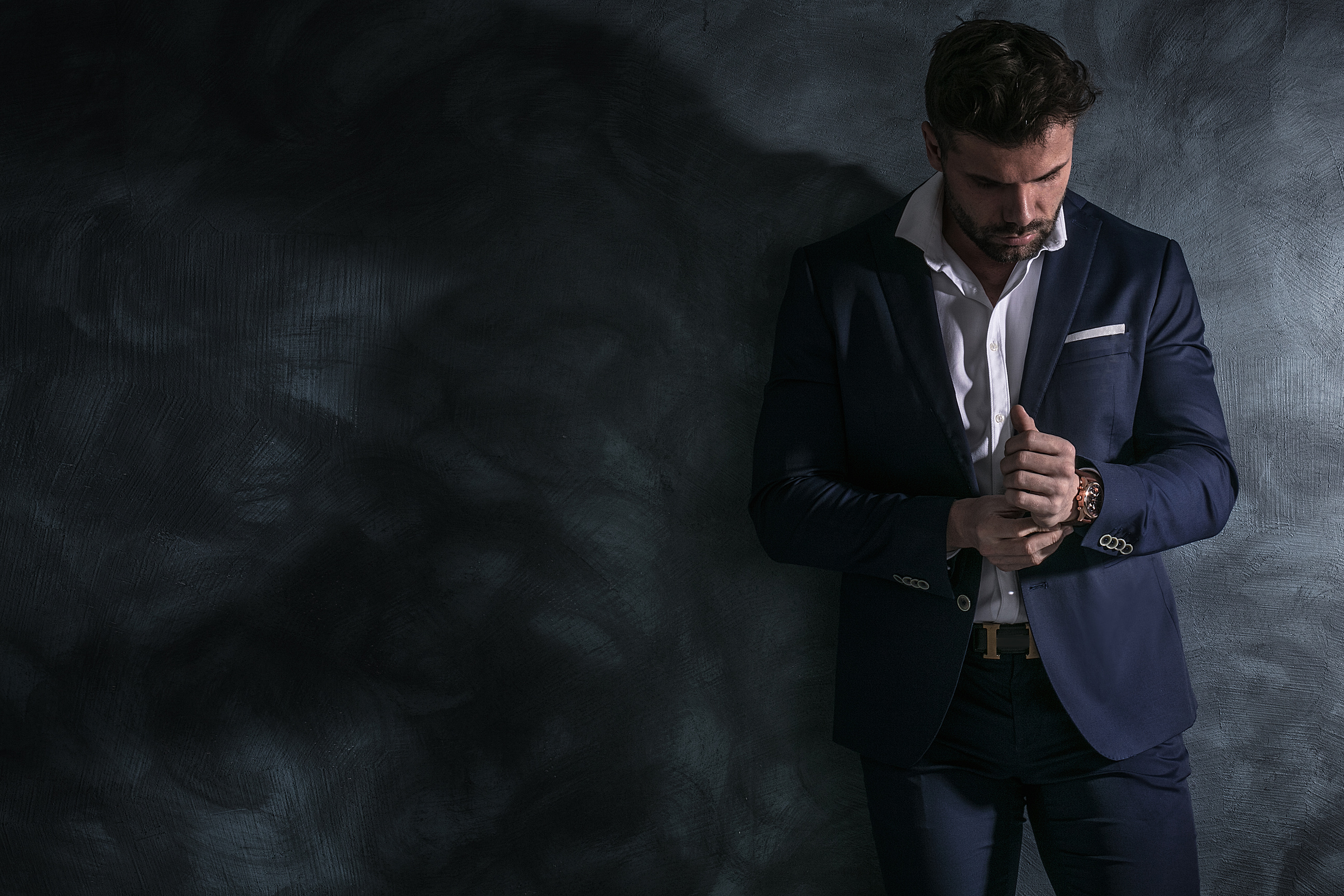 Portrait of handsome man in elegant suit.